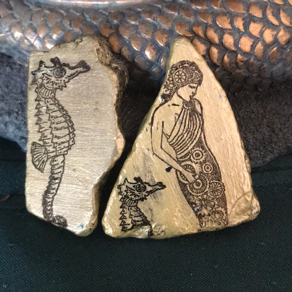 A Steampunk Mermaid and Seahorses on Stones